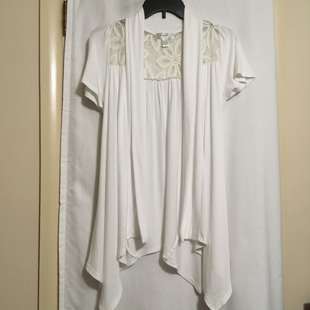 Soft , flowy knit cardigan with asymmetrical hem.